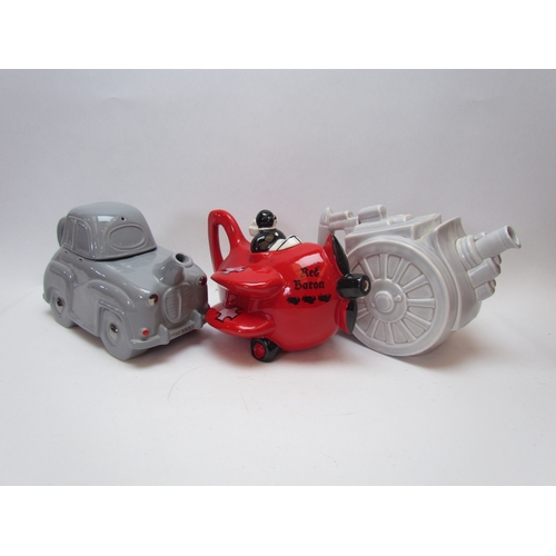 1217 - Two Carlton Ware novelty teapots, Red Baron and car together with a cannon form teapot (3)