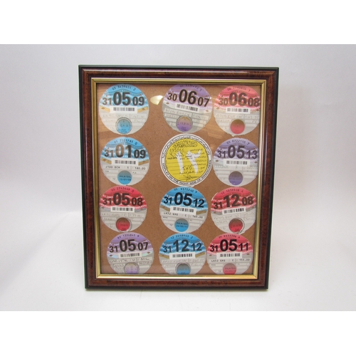 1222 - Twelve vintage tax discs framed as on, 29cm x 24cm  (C)