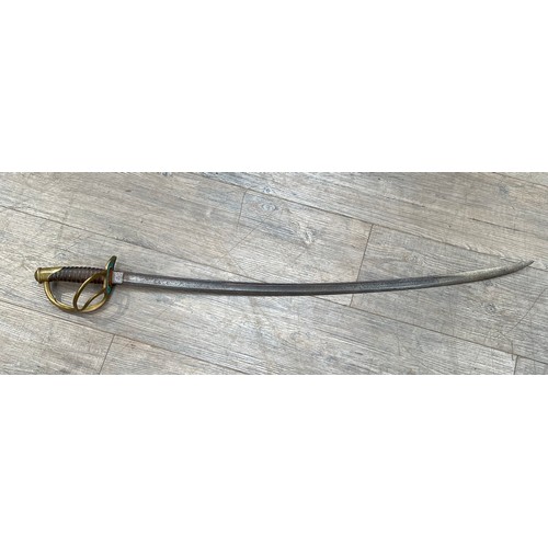 8397 - A US model 1860 Civil War cavalry officer's sword, brass hilt, some corrosion to blade