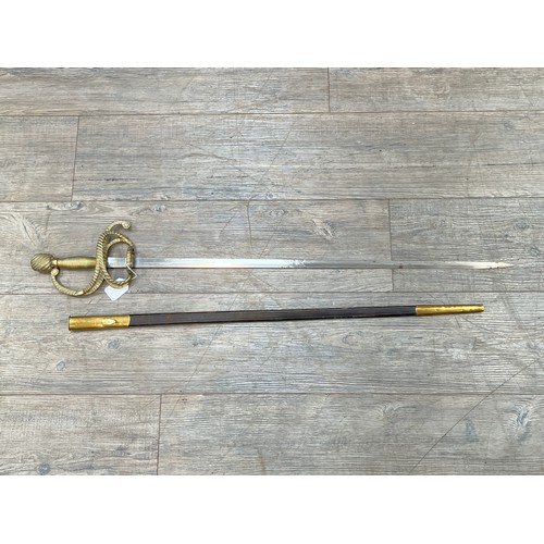 8401 - A Whites of London rapier sword, brass rope design hilt, tapering blade, with leather and brass moun... 