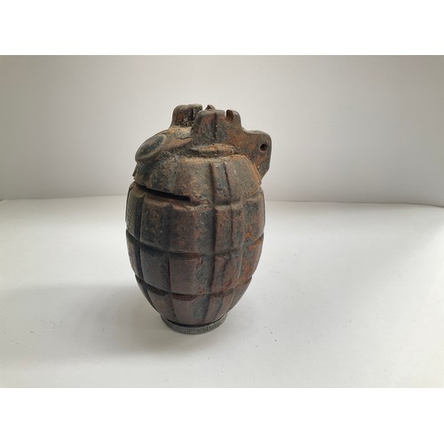 8560 - A WWII Mills No. 36 hand grenade converted into a money box, slit cut through the top