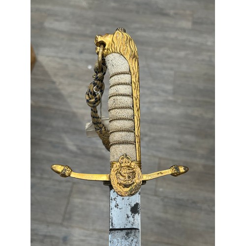 8406 - A George VI Naval officer's dirk, gilt brass hilt with ray skin grip, with associated belt. From the... 