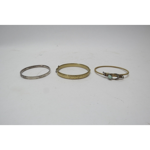 1240 - A silver Charles Horner child's bangle, a 9ct rolled gold stiff hinged bangle and a Victorian yellow... 