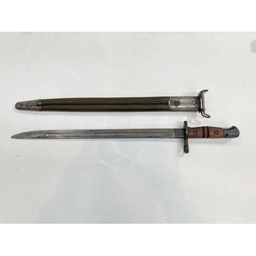 8418 - A WWI US 1917 bayonet by Remington, dated 1917, with a flaming grenade stamp, with scabbard