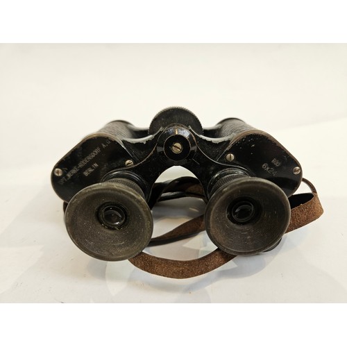 8250 - Two pairs of binoculars with leather cases  (C)