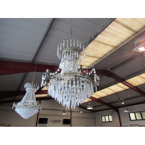 1404 - A large eight-arm chandelier with cut glass droplets