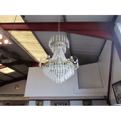 1404 - A large eight-arm chandelier with cut glass droplets