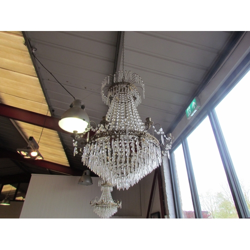 1405 - A six-arm chandelier with cut glass droplets