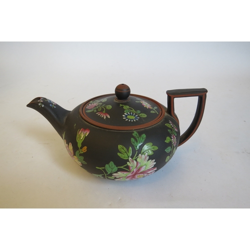 1364 - A Wedgwood basalt teapot with chinoiserie floral enamels