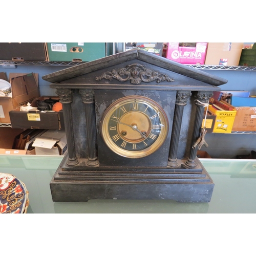 1368 - A late Victorian black slate mantel clock of architectural form, column detail, gilt brass face