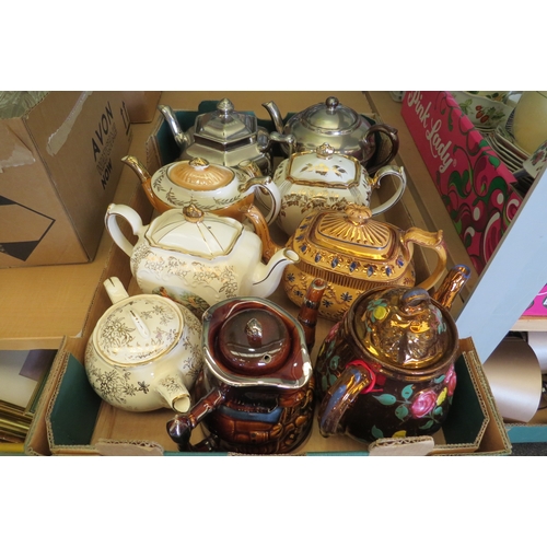 1385 - A box containing nine assorted teapots, mainly lustre examples