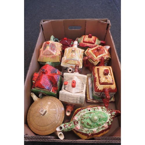 1383 - A box containing nine Cottage Ware teapots and similar biscuit barrel