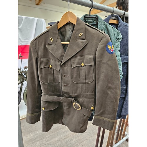 8266 - A quantity of military uniform including 1952 RAF Service Dress and two post war US service jackets