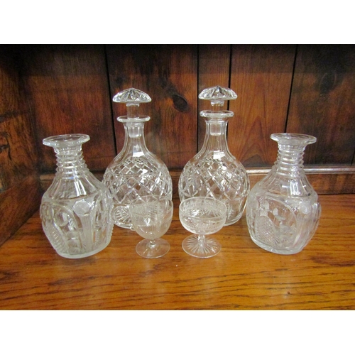 4067 - Two 19th Century pairs of decanters, one pair without stoppers and chip to rim of one, and two glass... 