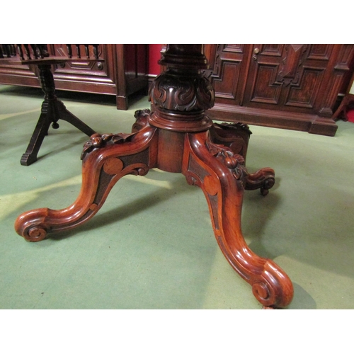 4068 - A Victorian walnut and rosewood oval-top loo table, on foliate carved quatreform base, 70cm tall x 1... 