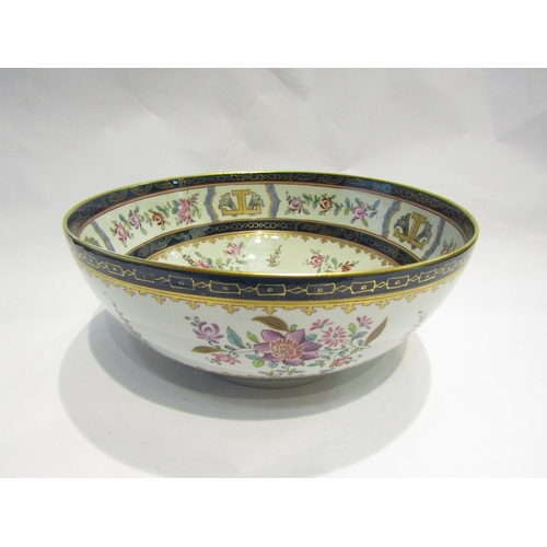 4106 - An Oriental footed bowl, enamel and gilt flower sprigs, Cobalt blue bands, 30cm diameter