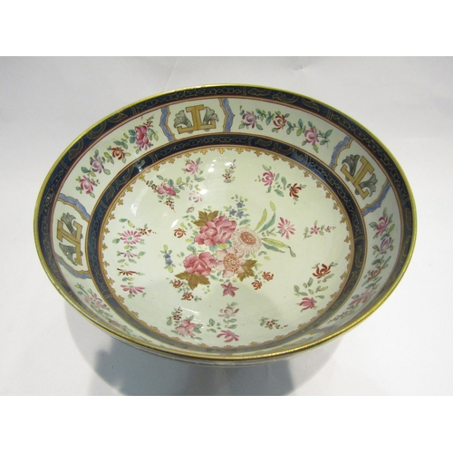 4106 - An Oriental footed bowl, enamel and gilt flower sprigs, Cobalt blue bands, 30cm diameter