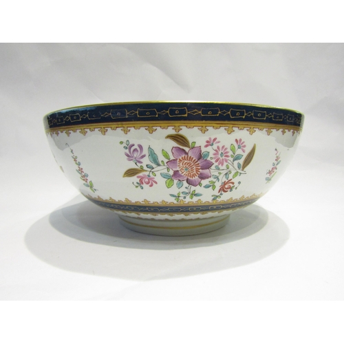 4106 - An Oriental footed bowl, enamel and gilt flower sprigs, Cobalt blue bands, 30cm diameter