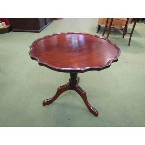 4107 - A George III style flame mahogany piecrust edge top occasional table on turned column and tripod bas... 