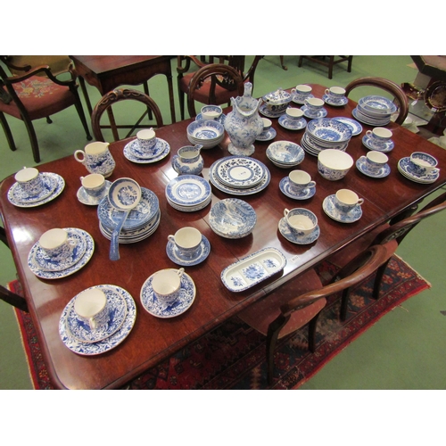 4110 - A good quantity of assorted blue and white, mostly Willow Ware comprising cups, saucers, plates, jug... 