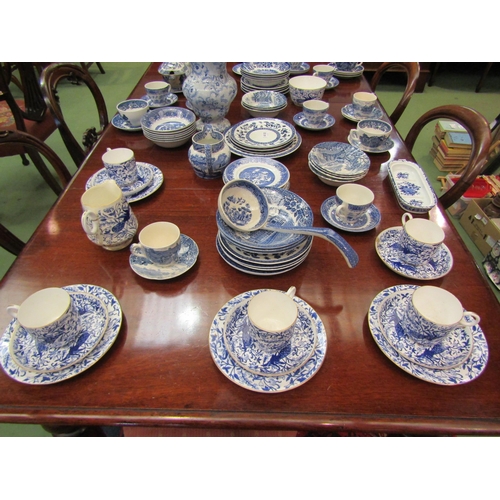 4110 - A good quantity of assorted blue and white, mostly Willow Ware comprising cups, saucers, plates, jug... 