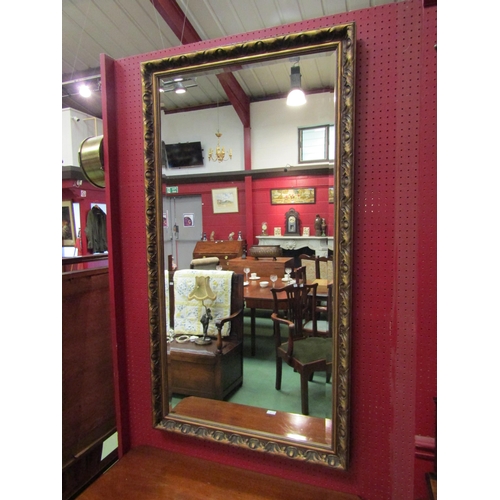 4112 - An ornate gilt frame bevelled edge rectangular wall mirror, 130cm x 70cm   (R) £45