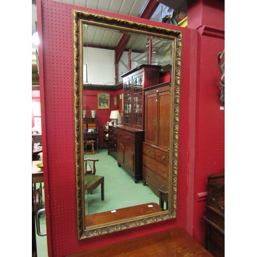 4112 - An ornate gilt frame bevelled edge rectangular wall mirror, 130cm x 70cm   (R) £45