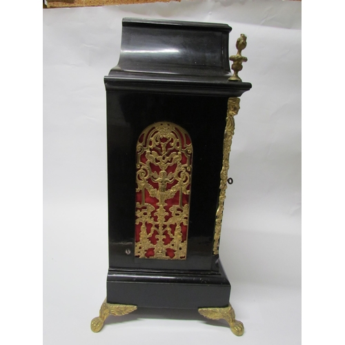 8052 - An 18th Century English ebonised bracket clock with cast brass feet, finials and side fret panels, s... 