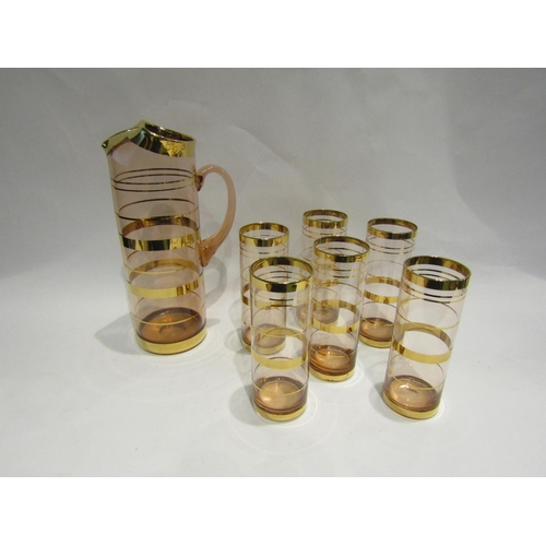 4464 - A 1960's tinted glass and gilt band water set with jug