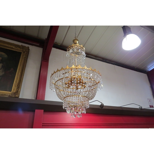 4484 - A drop crystal chandelier, five tier, nine lights.
53cm diameter, 95cm drop   (R) £120