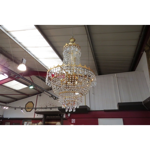 4484 - A drop crystal chandelier, five tier, nine lights.
53cm diameter, 95cm drop   (R) £120