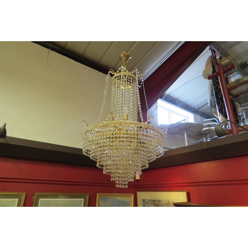 4485 - A Swarovski style crystal chandelier, six drop tier, eight lights. 
61cm diameter (inc branches), 10... 