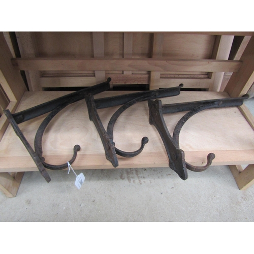 3598 - Three cast iron/saddle brackets