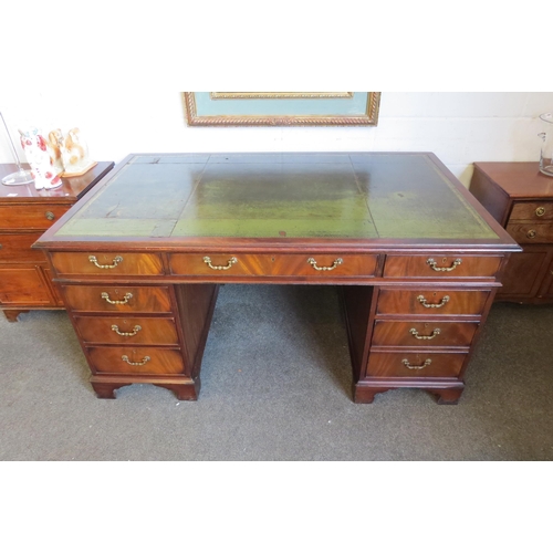 1112 - A George III style flame mahogany twin pedestal desk of eight drawers over bracket feet, leather top... 