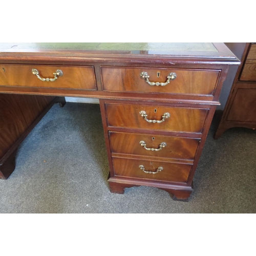 1112 - A George III style flame mahogany twin pedestal desk of eight drawers over bracket feet, leather top... 