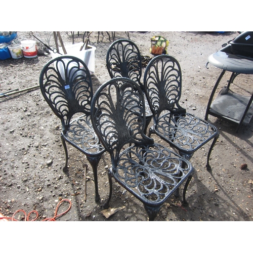 3565 - Four cast alloy garden chairs