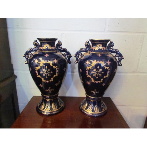 1004 - A pair of Royal Limoges cobalt blue vases with transferware figural scene panels and gilt detailing,... 