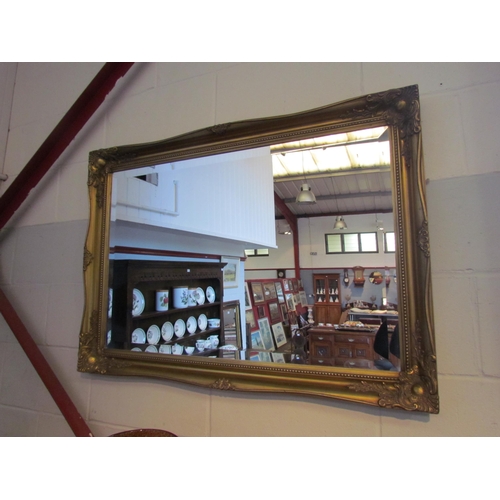 1006 - A gilt moulded antique style wall mirror, bevel edged, 60cm x 90cm