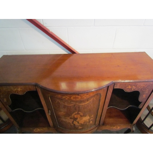 1010 - An Edwardian walnut sideboard, marquetry ribbon with swag and foliage, the bow fronted central door ... 