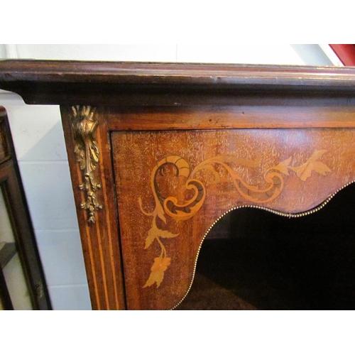 1010 - An Edwardian walnut sideboard, marquetry ribbon with swag and foliage, the bow fronted central door ... 