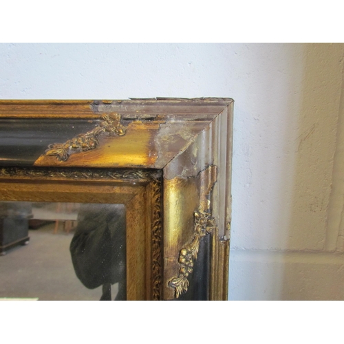 1018 - A gilt and ebonised rectangular wall mirror, 67cm x 57cm total, frame a/f    (E)  £20-30