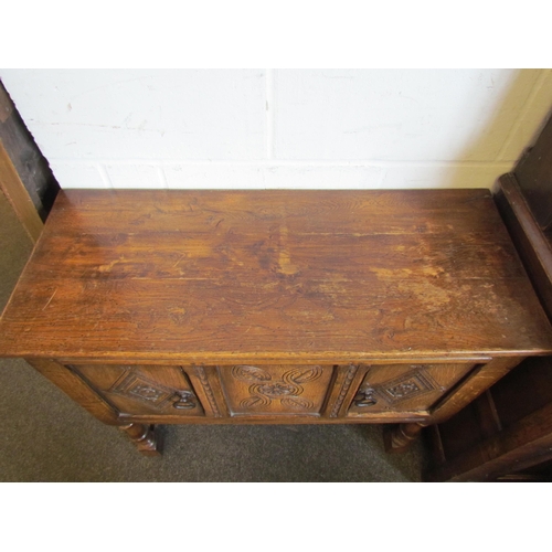 1019 - A 20th Century oak sideboard of small proportions on 'H' stretcher base, possibly Titchmarsh & Goodw... 