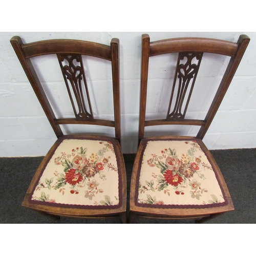 1022 - A pair of 19th Century mahogany side chairs with pierced backs and floral seats on stretcher bases