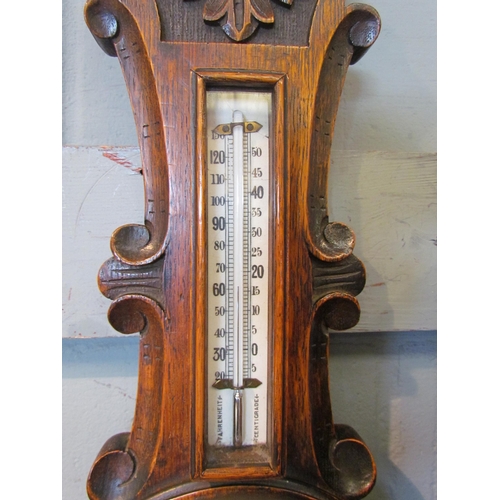 1055 - An Edwardian oak cased banjo barometer