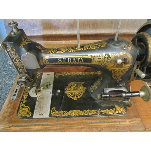 1060 - An early 20th Century Serata hand operated sewing machine, case with key