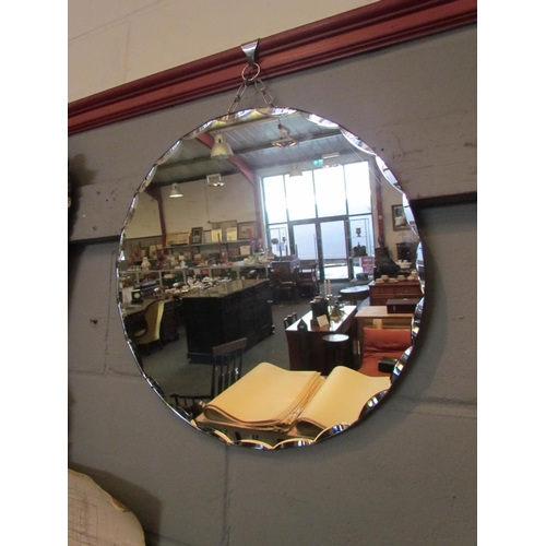 1061 - A bevel edged circular wall mirror, 45cm diameter