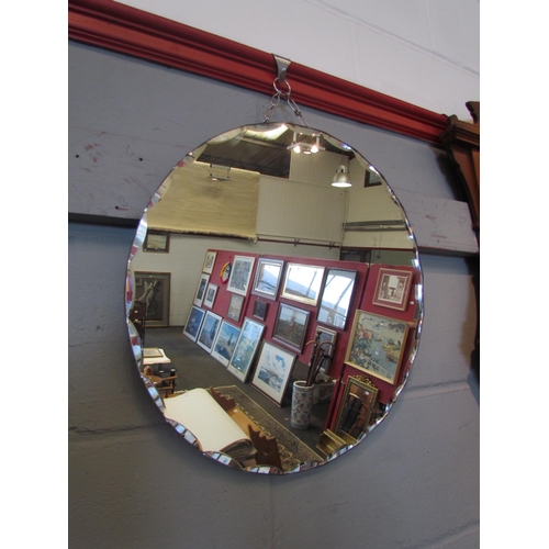 1061 - A bevel edged circular wall mirror, 45cm diameter