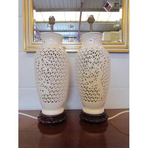 1072 - A pair of blanc-de-chine pierced table lamp bases (no shades)