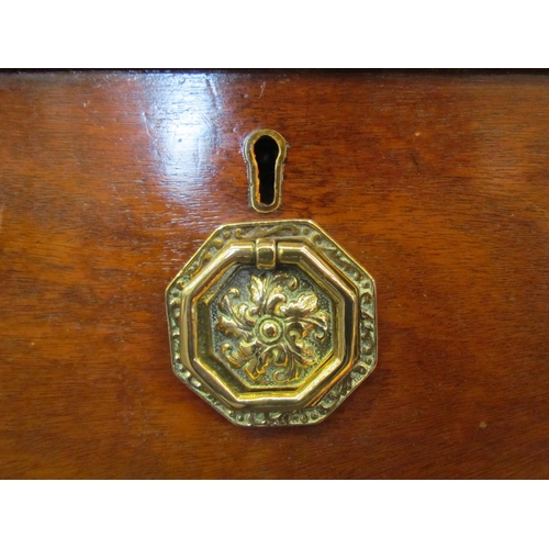 1074 - A 19th Century oak chest of two short over two long drawers, octagonal brass handles, on outswept br... 