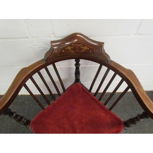 1075 - An Edwardian marquetry inlaid corner chair, spindle and slat back on turned legs with red velvet sea... 